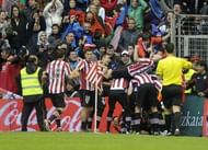 Athletic Bilbao's players celebrate after scoring their second goal against Barcelona in Bilbao on April 27, 2013